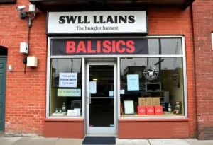A storefront of a Baltimore business with visible security features.