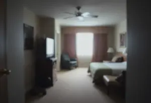 A somber hotel room representing issues in Maryland's foster care.