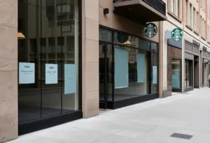 Closed Starbucks store in Baltimore with papered windows