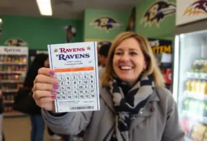 Woman celebrating her lottery win in store